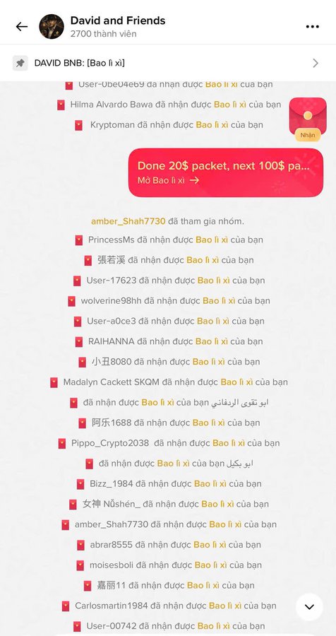 A screenshot of a Telegram group chat titled 'David and Friends' with 2700 members, showing a message 'Done 20xx packet, next 100$ pa...' and multiple users receiving 'Bao lì xì' red envelopes.