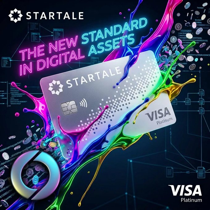 A promotional advertisement for a Startale Visa Platinum credit card, featuring the text 'THE NEW STANDARD IN DIGITAL ASSETS' in neon pink and blue lettering against a dark background with colorful paint splashes.