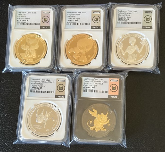 Five NGC-graded Veefriends Coins 2026 in protective slabs, featuring various character designs and labeled as GEM PROOF in different metal finishes (Gold, Silvered, Blackened).
