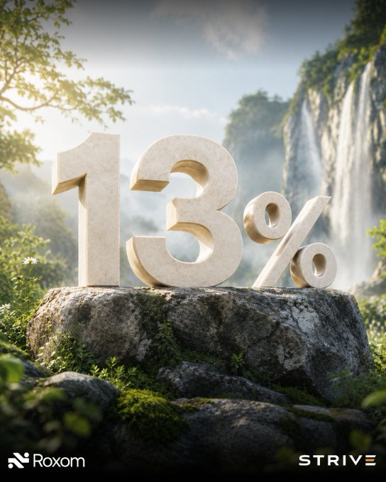 The image features a large rock with the numbers 13 written on top of it, surrounded by greenery such as trees and bushes. The background includes a waterfall and mountains, creating an outdoor setting for this advertisement. The text "Roxom" is also present in the image.