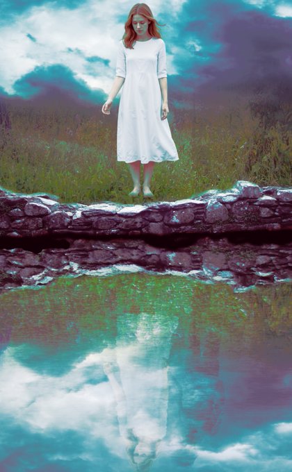 A surreal, edited photo showing a red-haired woman in a white dress standing barefoot on a stone bridge over water, with a vivid reflection and dramatic cloudy sky in the background.