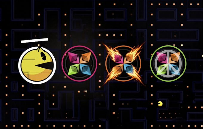 A dark scene from a Pac-Man style game showing a yellow Pac-Man character alongside three colorful gem-like power-ups.