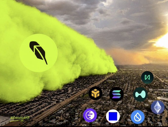 A dramatic aerial image showing a massive lime-green dust cloud rolling over a city at sunset, with various cryptocurrency logos (Robinhood, Binance, Solana, etc.) overlaid on the image.