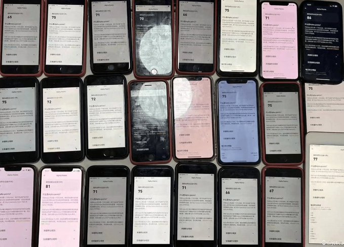 A collection of numerous iPhones arranged in rows on a surface, each screen displaying an Apple Points redemption page with various point values (65, 75, 71, 70, 66, 71, 86, 72, 75, 77, 81, 66, 47).