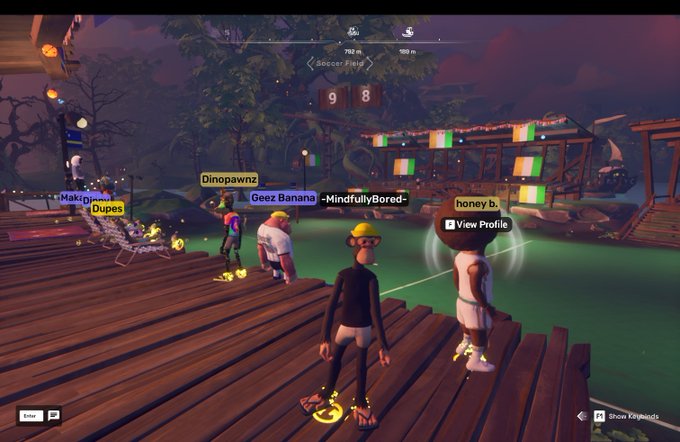 Four animated avatars — "Dinopawnz," "Geez Banana," "MindfullyBored-," and "honey b." — gather on a wooden dock in OthersideMeta near the "Soccer Field," where two players named "Makib.." and "Dupes" appear to be playing with a ball, illustrating the post about the user stumbling upon a spontaneous soccer game while doing their daily quests.