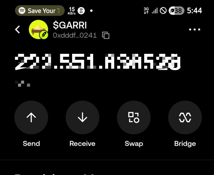 A mobile screenshot of a cryptocurrency wallet displaying a "$GARRI" token with the wallet address starting "0xddf...0241" and a balance of approximately 221,551,834,520 tokens, supporting the user's post about now holding $GARRI. The interface shows standard wallet functions (Send, Receive, Swap, Bridge) below the balance.