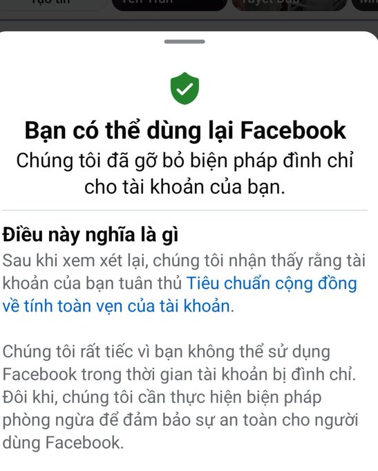 A Facebook notification in Vietnamese stating "Bạn có thể dùng lại Facebook - Chúng tôi đã gỡ bỏ biện pháp đình chỉ cho tài khoản của bạn" (You can use Facebook again - We have removed the suspension on your account).