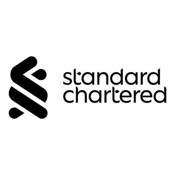 The image displays the Standard Chartered logo, featuring its signature stylized emblem alongside the company's name. This relates to the post, which cites Standard Chartered's bullish Bitcoin price prediction, with the bank's digital assets head attributing potential BTC strength to supportive Treasury liquidity measures.