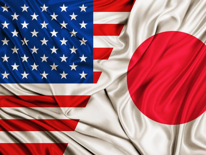 The image shows a split view of the American and Japanese flags, symbolizing a comparison between the two nations' crypto regulations as described in the accompanying post.