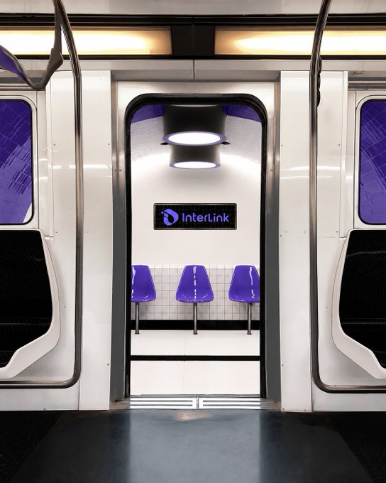 A view through the open doors of a modern train or subway car reveals a station platform featuring three purple seats and a sign reading "InterLink," visually echoing the post's announcement about the InterLink Ecosystem.