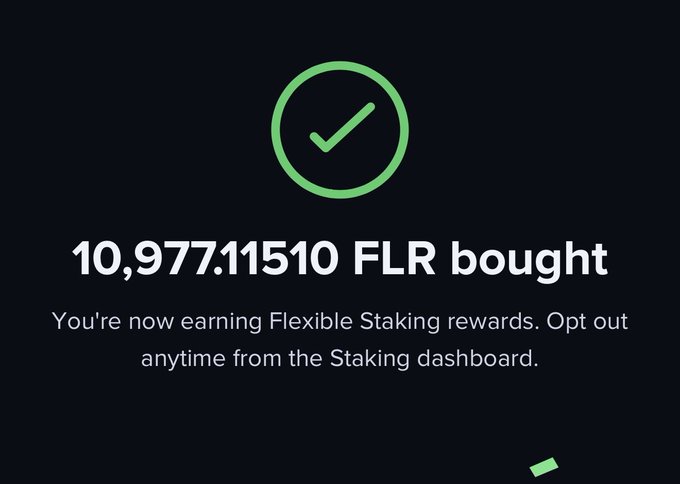 A dark screen displays a green checkmark icon and the text '10,977.11510 FLR bought' with a subtext reading 'You're now earning Flexible Staking rewards. Opt out anytime from the Staking dashboard.'