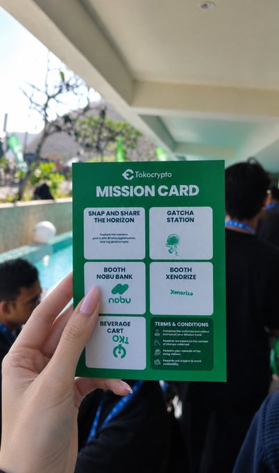 A hand holds a green "MISSION CARD" featuring a cartoon firefighter pointing upward, with text detailing a four-step challenge: 1) Take a photo with an "Our 9/11 Memorial" sign, 2) find an EMT and ask how to help in a car accident, 3) visit the FDNY Fire Zone (located across from the WTC memorial), and 4) post the photo with hashtags #NYC #FDNY #newyorkcityfiredepartment. The card connects to the post's theme of exploring the Fire Department of New York as part of a tourist mission in New York City.