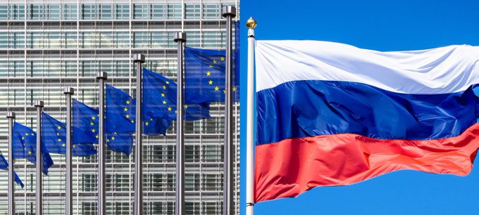 The flags of the European Union and Russia are shown, symbolizing the EU's new sanctions package that targets Russian oil and crypto platforms.