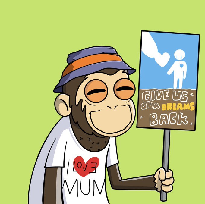 A cartoon monkey character wearing a purple and orange hat and a white t-shirt that reads 'I [heart] MUM' holds a protest sign stating 'GIVE US OUR DREAMS BACK'.