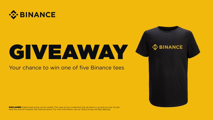 A yellow promotional banner for Binance announces a 'GIVEAWAY' offering a chance to win one of five Binance tee shirts, featuring a dark blue t-shirt with the Binance logo.