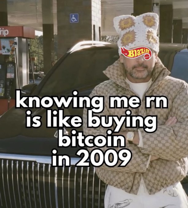 A meme image shows a man in a designer jacket and crocheted bucket hat with a 'Blazin'' sticker, standing in front of a Rolls Royce with text reading 'knowing me rn is like buying bitcoin in 2009'.