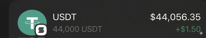 The image shows a black screen with a green circle that reads "Usdt", followed by a white dollar sign, and then a number. The text also includes the words "44,000" and "USDT". The image seems to be related to an online transaction or discussion about cryptocurrency, as it is described in terms of money being sent from one person to another.