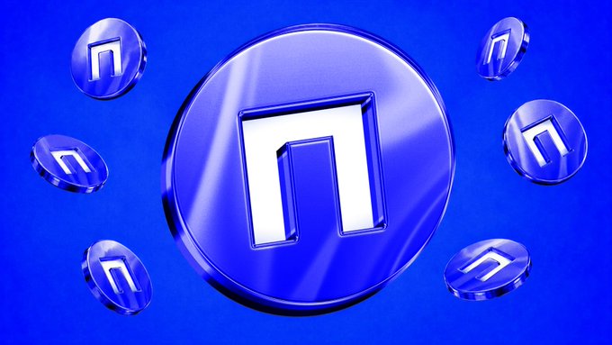 A glossy blue circular token prominently displays a stylized "N" symbol, surrounded by six smaller identical tokens floating against a deep blue background, visually reinforcing the post's emphasis on $NIL as the foundational currency driving Nillion's encrypted marketplace economy.