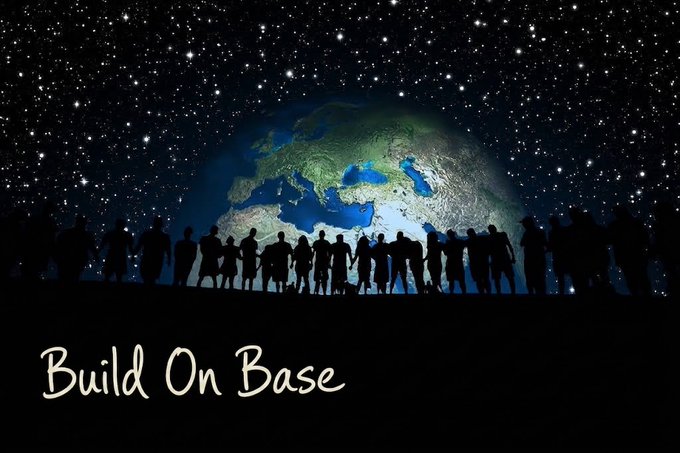 A silhouette of a crowd of people stands against a starry night sky with Earth visible, with the text "Build On Base" written in white at the bottom.