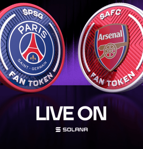 The image features two circular logos, one for Paris Saint-Germain (PSG) and another for Arsenal Football Club (Afc). The PSG logo has a blue background with white text that says "Paris Saint-Germain", while the Arsenal logo has a red background with white text that says "Arsenal Fan Tokens". Both logos are circular in shape, and they appear to be placed on a purple background. In the bottom right corner of the image, there is a small text that reads "Live On" followed by an image of a fan token.