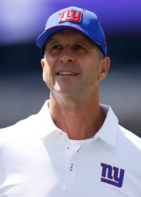 A close-up portrait shows an older man wearing a blue and red New York Giants ('ny') baseball cap and a white polo shirt with the same logo.