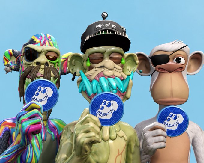 Three stylized 3D-rendered NFT character figures hold blue coins featuring a white skull logo; the left figure has a colorful swirled pattern, the center figure is a green goblin-like creature wearing a black cap labeled 'MAXX' with sharp teeth, and the right figure is a white monkey with an eye patch.