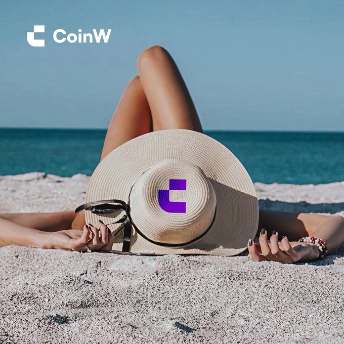 A promotional image for 'CoinW' featuring a person lying on a sandy beach, their face obscured by a straw sun hat, with a purple 'C' logo printed on the hat.