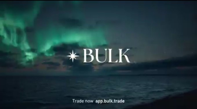 An advertisement with the word 'BULK' displayed against a backdrop of green auroras over an ocean, with the text 'Trade now app.bulk.trade' at the bottom.
