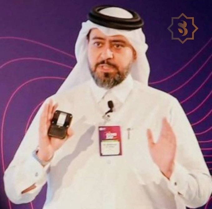 A man in traditional Gulf attire speaks while holding a small box at what appears to be a Sidra-related event, with a lapel pin and "SIDRA" badge visible. The image likely represents a Sidra ecosystem representative or ambassador sharing updates about the project's development, including the newly mentioned SidraStart.com platform for builders and investors.