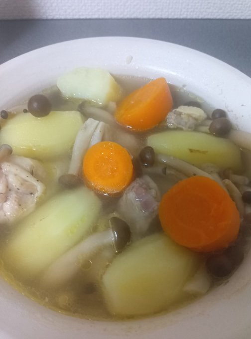 A bowl of pot-au-feu featuring carrots, potatoes, mushrooms, and chicken in a light broth, served in a white dish. The warm, home-cooked stew reflects the post's theme of preparing a requested meal for loved ones sharing time under one roof.