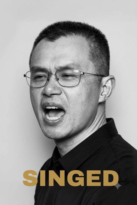 A black-and-white portrait shows a man with glasses speaking, with the word 'SINGED' in gold text at the bottom.