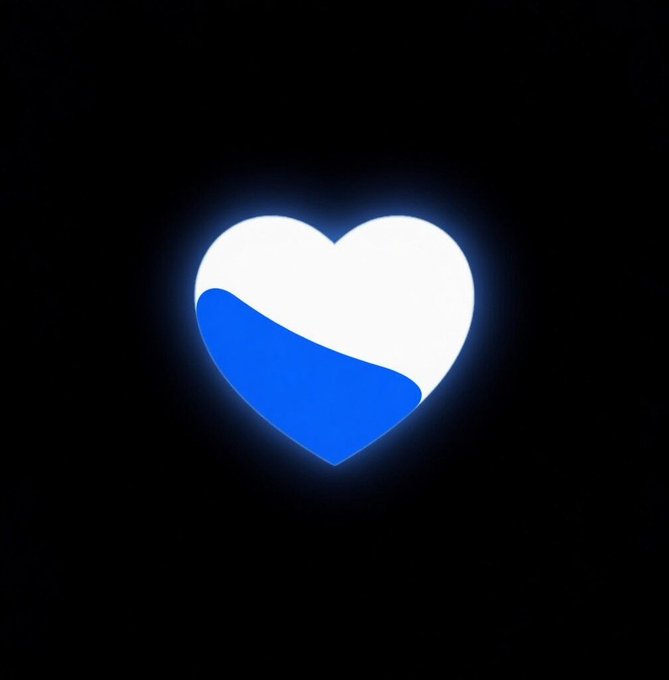 The image features a heart shape that has been colored blue and white, giving it a unique appearance against a black background. The heart appears to be glowing or illuminated, which adds an interesting visual element to the scene. The caption of the image is related to the heart design in some way but does not provide enough context for me to fully understand its connection with the post.