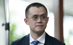 A bespectacled man in a dark suit and tie is shown in a headshot portrait, likely representing a Binance executive or industry commentator discussing the company's exclusion from the EU's MiCA regulatory framework and its implications for European investors.