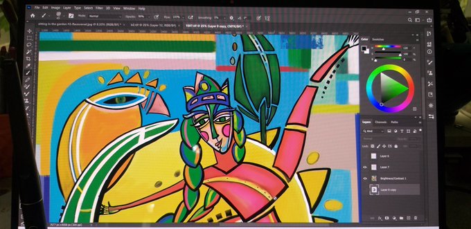 A computer monitor displays digital artwork in progress within Photoshop, featuring a stylized figure with a crown surrounded by abstract colorful shapes.