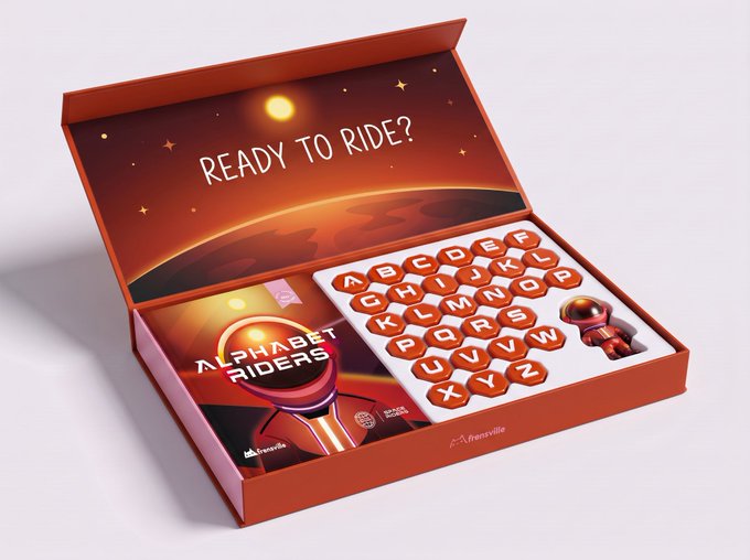 An open orange "Alphabet Riders" box displays a space-themed design with "READY TO RIDE?" printed on the inside lid, alongside a letter board featuring A-Z hexagonal pieces and a small astronaut figure. The playful packaging, with its cosmic branding by Frenville, visually echoes the post's hypothetical question about an unconventional, off-planet-style concept.