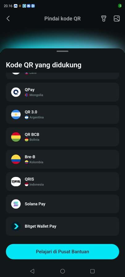 The image shows a smartphone screen displaying a "Pindai kode QR" (Scan QR code) interface with a list of supported QR codes, including "QRIS" from Indonesia. This directly supports the post by indicating that the wallet app now features QRIS scanning capability, enabling Crypto payments for Indonesian merchants.