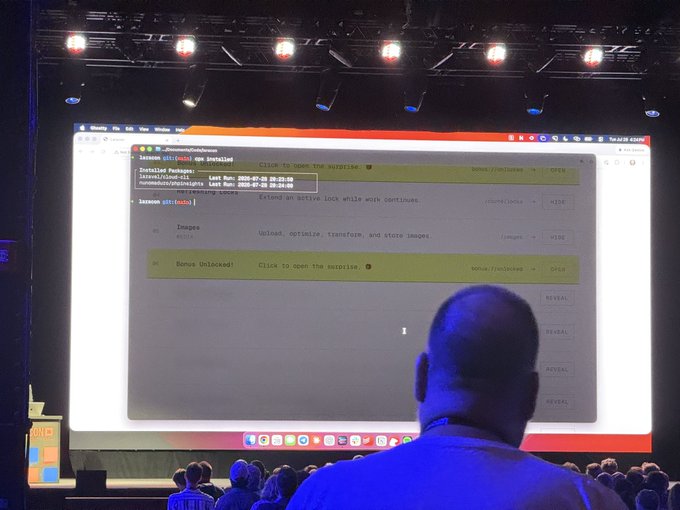 The image shows a stage presentation displaying a terminal with package installation commands including "Detailed Packages" and "Bonus Unlocked" messages, likely from Liam Hammett's CPX tool launching its 2.0 version.