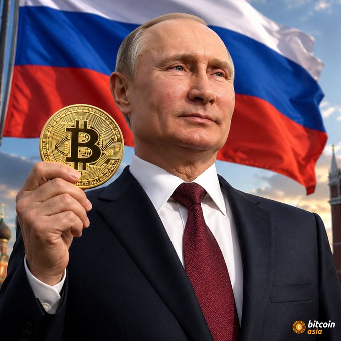 Vladimir Putin holds a gold Bitcoin coin with the Russian flag in the background, while the 'bitcoin asia' logo appears in the bottom right corner.