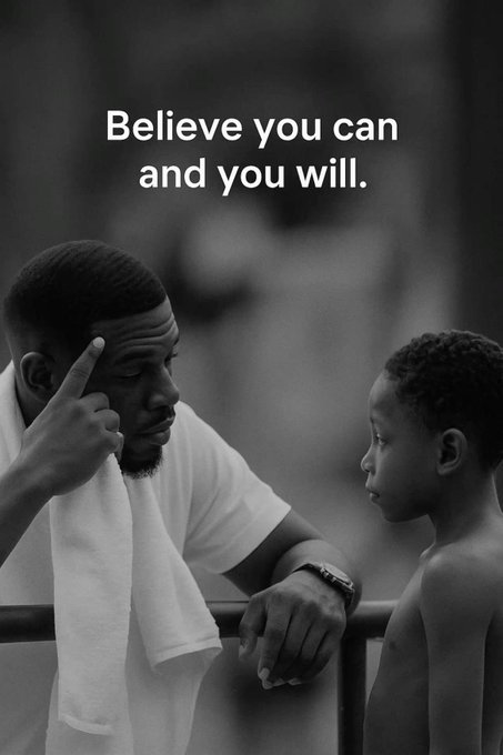 A black and white motivational image shows a man with a towel on his shoulder pointing to his temple while speaking to a young boy, with the text 'Believe you can and you will.' overlaid.