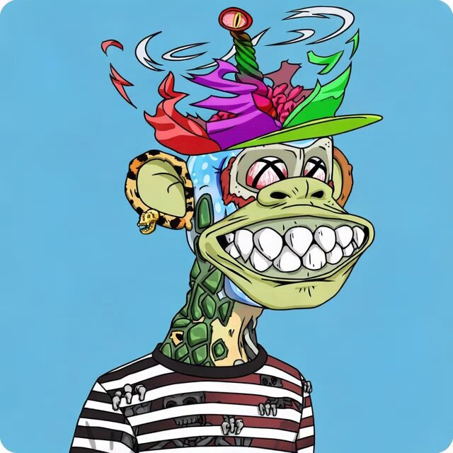 The image features a cartoon monkey wearing a hat with various colors and designs, including a green top hat adorned with a red crown. The monkey appears to be smiling and has a unique appearance that stands out against the blue background of the image.
