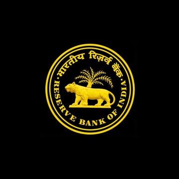 The image displays the official emblem of the Reserve Bank of India (RBI), featuring a tiger and palm tree within a golden circular seal, set against a black background. This emblem visually represents the central authority referenced in the post, which highlights the RBI's stance on prohibiting cryptocurrency due to concerns over tax evasion risks.