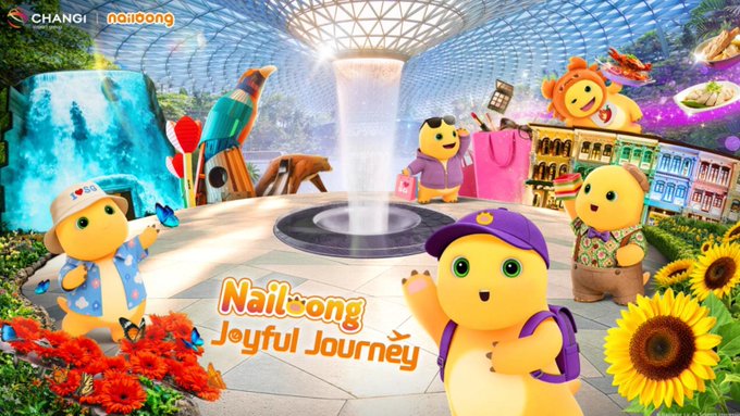 A vibrant promotional image for "$NAILOONG Joyful Journey," featuring cheerful cartoon bear characters in travel attire set against iconic landmarks like the Eiffel Tower and Changi Airport under a glass dome with a central indoor waterfall, tied to the "$NAILOONG will be everywhere" message by showcasing the mascot's global, travel-ready presence.