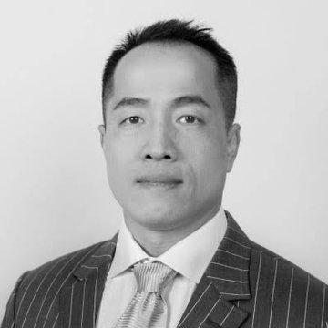 A black-and-white professional headshot of an Asian man wearing a pinstripe suit and striped tie, representing Harry Chun Tak Yeh, the Chinese crypto investor and founder of Quantum Fintech Group mentioned in the post.