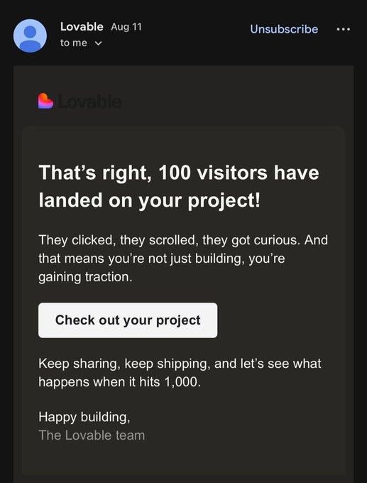 A screenshot of an email from 'Lovable' congratulating the recipient, stating 'That's right, 100 visitors have landed on your project!' and encouraging them to 'Check out your project'.
