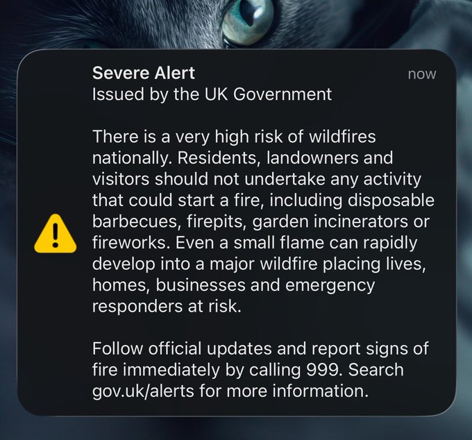 A UK Government 'Severe Alert' notification warning of a very high risk of wildfires nationally, advising against activities like barbecues, firepits, and fireworks, and instructing to call 999 in an emergency.