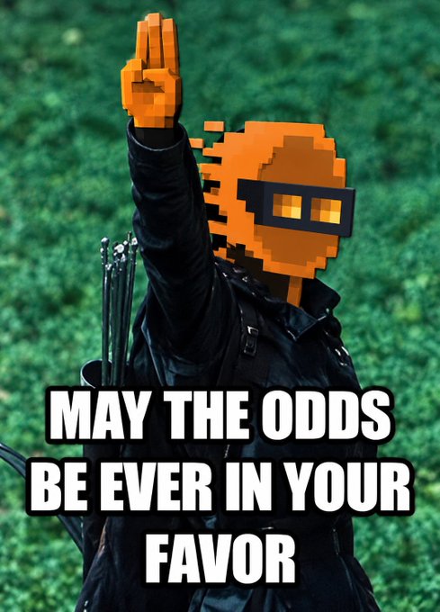 A digitally edited image shows a pixelated orange character wearing VR goggles and holding up a hand gesture, with arrows in a quiver on their back, overlaid with the text 'MAY THE ODDS BE EVER IN YOUR FAVOR.'