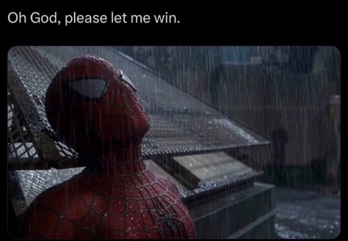 Spider-Man stands in the rain looking upward at the text "Oh God, please let me win." displayed at the top of the meme.