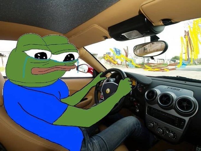 An edited image of the 'Sad Pepe' frog meme crying while sitting in the driver's seat of a Ferrari, with chaotic scribbles drawn over the windshield view.