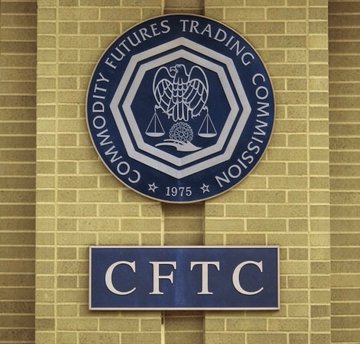 The image shows the seal and emblem of the Commodity Futures Trading Commission (CFTC), established in 1975, mounted on a brick wall with the agency's acronym displayed below. This visually represents the regulatory body mentioned in the post, which is reportedly shifting its stance on crypto oversight by proposing new CTX and CAM frameworks rather than relying solely on enforcement actions.