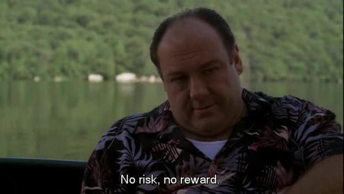 A scene featuring Tony Soprano (James Gandolfini) in a Hawaiian shirt on a boat, with the subtitle 'No risk, no reward.'